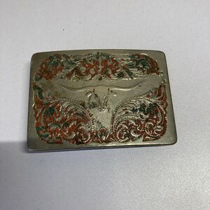 Western-Style Longhorn Steer Skull belt buckle with red and green enamel accents